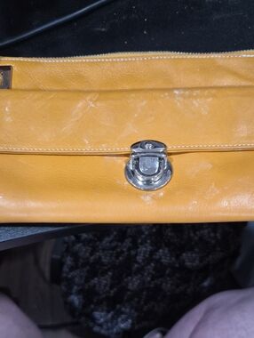 Perlina Mustard Yellow Leather Wristlet with Silver-Tone Lock